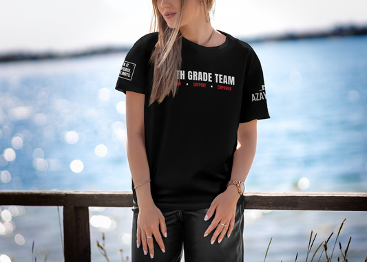 Azayafit Stronger Together custom team t-shirt for teachers, black performance tee, motivational text on front, worn by person by a body of water.