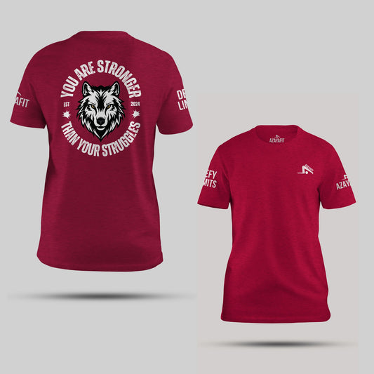 Red t-shirt with motivational quote and wolf graphic on a gray background