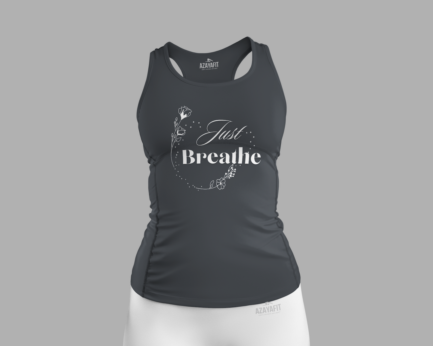 Black tank top with 'Just Breathe' text and white shorts on a gray background