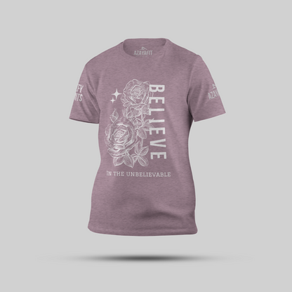 Purple t-shirt with a rose design and motivational text on a gray background