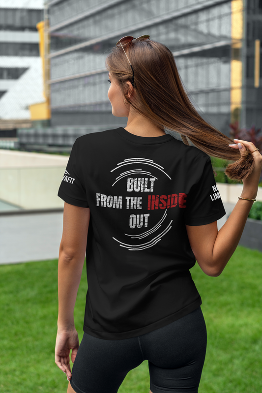 Woman wearing a black t-shirt with text outdoors