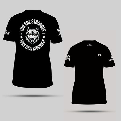 Black t-shirt with wolf graphic and motivational text on a gray background