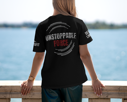 model wearing black tee with unstoppable force text while looking over a bridge