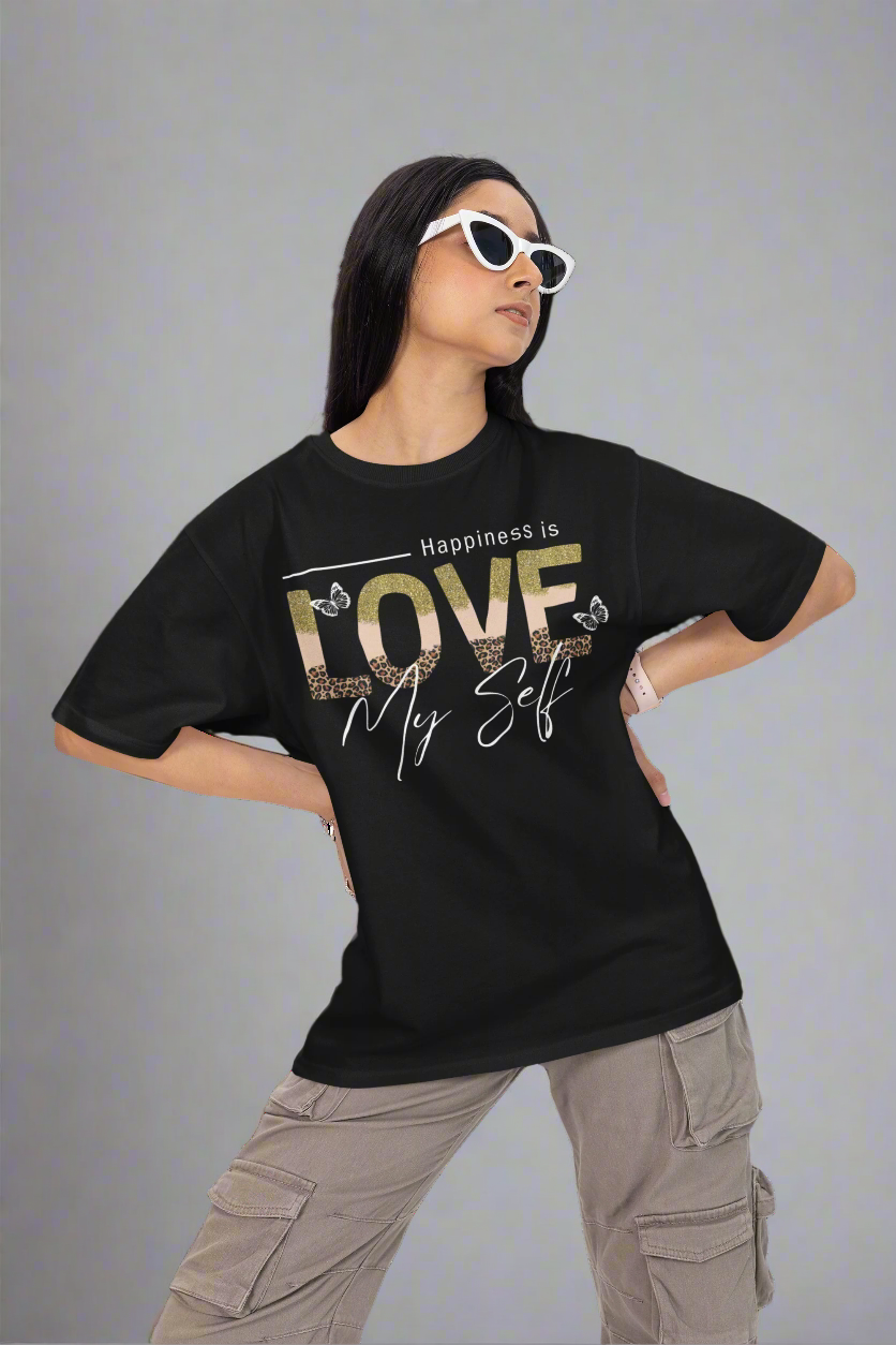 Woman wearing cool glasses and posing with her hands on her waist while wearing a black Love Myself unisex T-shirt. This stylish and comfortable tee promotes self-love and confidence, perfect for everyday wear.